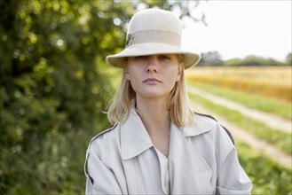 young woman with fedora