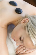 Woman enjoying hot stone massage