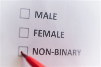 Pen marking on male, female and non binary gender checklist