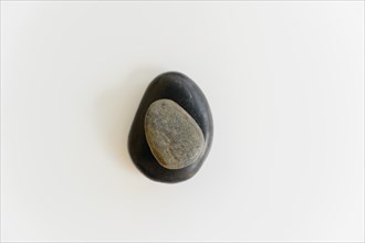 Composition of two stones on white background