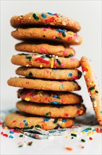 Pile of homemade cookies with colorful sprinkle