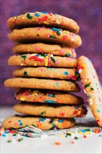 Pile of homemade cookies with colorful sprinkle