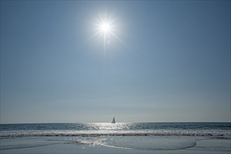 Lone sailboat in ocean