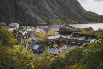 Norway, Lofoten Islands, Nusfjord, Scenic view of traditional fishing village with red houses