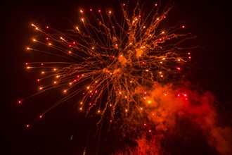 Red fireworks at night