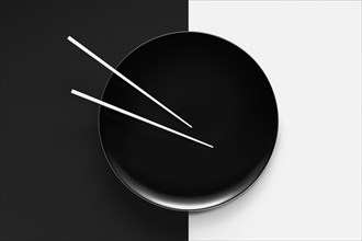 Empty plate with chopsticks