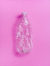 Plastic bottle on pink background