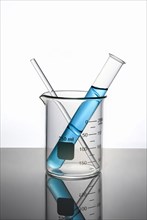 Blue liquid in test tube inside beaker