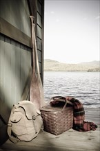 Oars and picnic supplies by lake