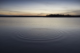 Ripples in lake at sunset