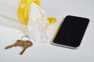 Disinfectant wipes, smart phone and keys