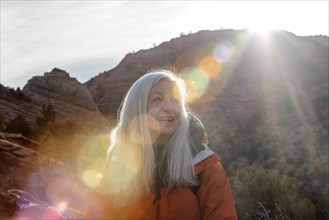 Smiling woman by canyon at Zion National Park in Utah, USA