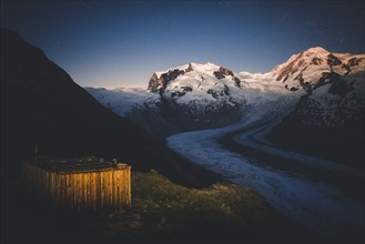 Shed by Gorner Glacier at sunset in Valais, Switzerland