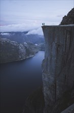 People standing on Preikestolen cliff in Rogaland, Norway