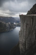 Person and tent on Preikestolen cliff in Rogaland, Norway