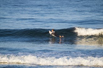 Teenage boy surfing