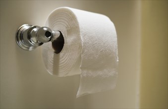 Close up of toilet paper on toilet roll holder