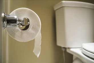Close up of toilet paper on toilet roll holder