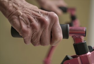 Close up of hands of senior woman on mobility walker