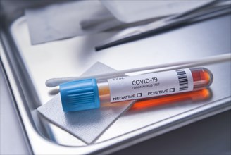 Test vial labelled 2019-nCoV on medical tray