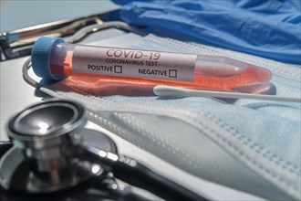 Covid-19 test vial among medical equipment
