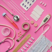 Medical supplies on pink background