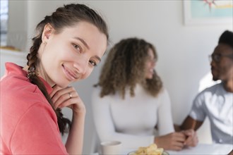 Woman smiling while hanging out with friends
