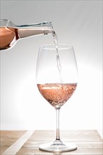 Rose wine being poured into glass