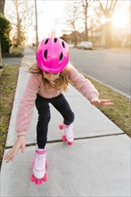 Rollerskating girl losing balance