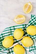 Fresh lemon on green cloth