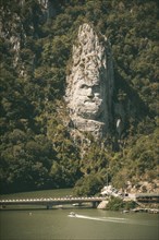 Romania, Dubova, Decebalus sculpture in rock over river