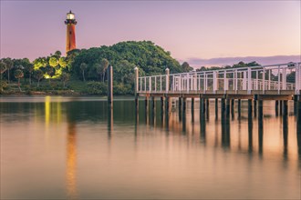 USA, Florida, Jupiter, Pier and lighthouse at dusk