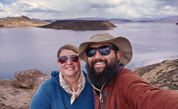 Peru, Sillustani, Portrait of couple by lake