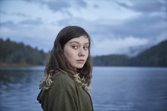 Portrait of girl by lake