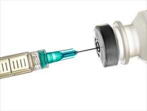 Studio shot of vaccine and syringe on white background