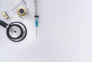 Studio shot of stethoscope, vials and syringe