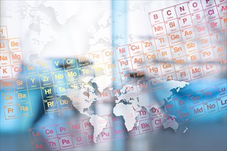 Digital composite with periodic table, laboratory glassware and world map