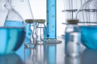 Laboratory glassware with blue liquid