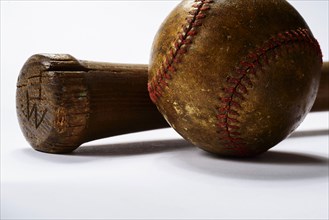Studio shot of old baseball bat and ball