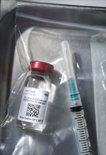 Covid-19 vaccine and syringe