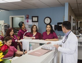 Doctor and nurses at reception desk