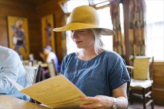 USA, Utah, Bryce Canyon, Woman looking at menu in restaurant