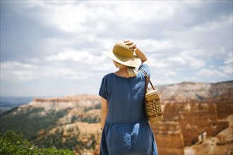 USA, Utah, Bryce Canyon, Woman in hat looking at canyon