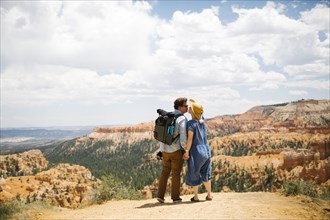 USA, Utah, Bryce Canyon, Couple holding hands and kissing against canyon