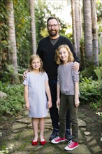USA, California, Orange County, Portrait of father with daughters (8-9, 12-13)