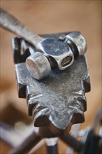 Close up of metal hammer and anvil