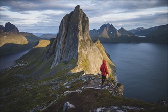 Norway, Senja, Man standing near Segla mountain