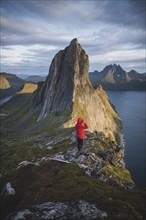Norway, Senja, Man hiking near Segla mountain