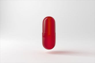 Studio shot of red capsule