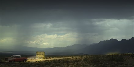 USA, Vintage car illuminating banner in desert